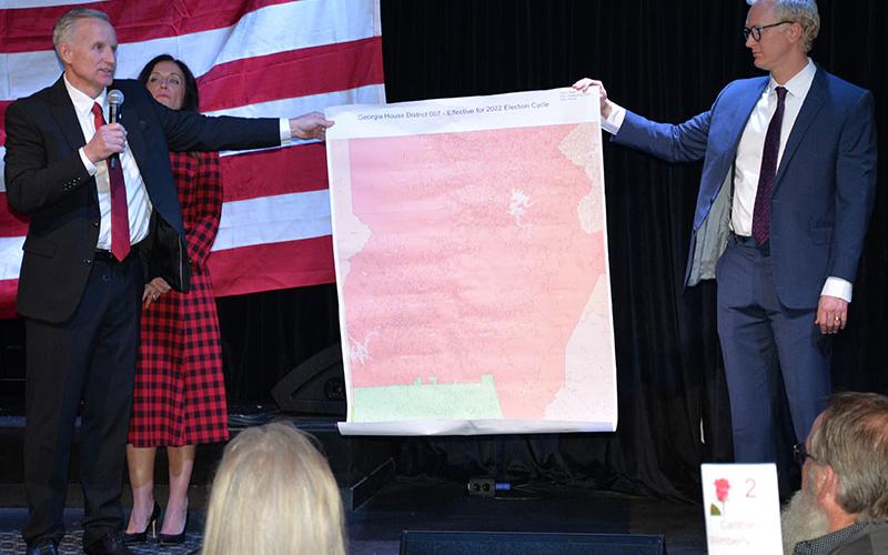 Johnny Chastain, newly elected District 7 representative to the Georgia House, and Fannin County Republican Party Chairman Frank Wood display a map of Chastain’s district. In the background is Chastain’s wife, Stacy.