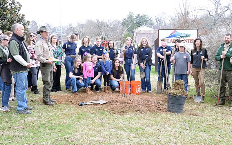 This is part of the crowd who gathered to celebrate Arbor Day last Thursday outside The Art Center on West Main Street in Blue Ridge. A Serviceberry tree was planted by members of the FFA from both Fannin County High School and Middle School  and 4-H club members with help from representatives of the Georgia Forestry Commission.