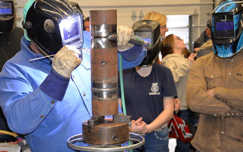 Nate Ponder of Western Welding Academy demonstrates proper technique during the academy’s stop at Fannin County High School. Ponder told students that jobs are plentiful in all trades, not just welding.