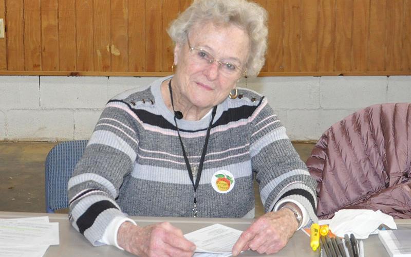 Anne Bailey is pictured at the Colwell voting precinct. She has volunteered at poll stations since the late 1980s.