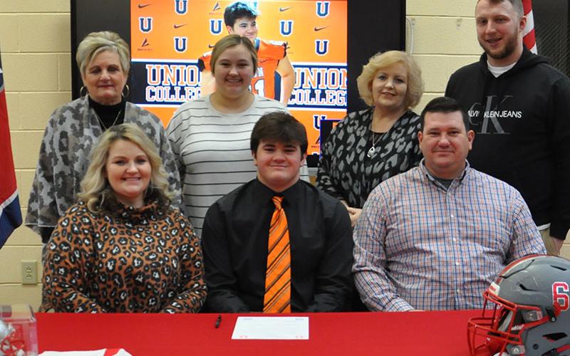 Addison Hook’s family joined him Wednesday morning, February 1, as he signed his Letter of Intent to play football for Union College. Pictured, from left, front row, are Courtney, Addison, and Jason Hook; and back, Billie Queen, Alex Johnson, Cindy Suits and Logan Suits.