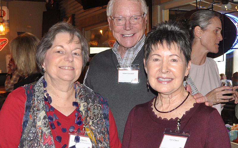 The Snack in a Backpack Champions for Children event was a night to honor members of the community who helped children by raising funds for the program. Pictured enjoying the event are, from left, Family Connections Executive Director Sherry Morris, Robert Gleadall and Gail O’Neill. Sherry Morris was presented the Community Champion Award.