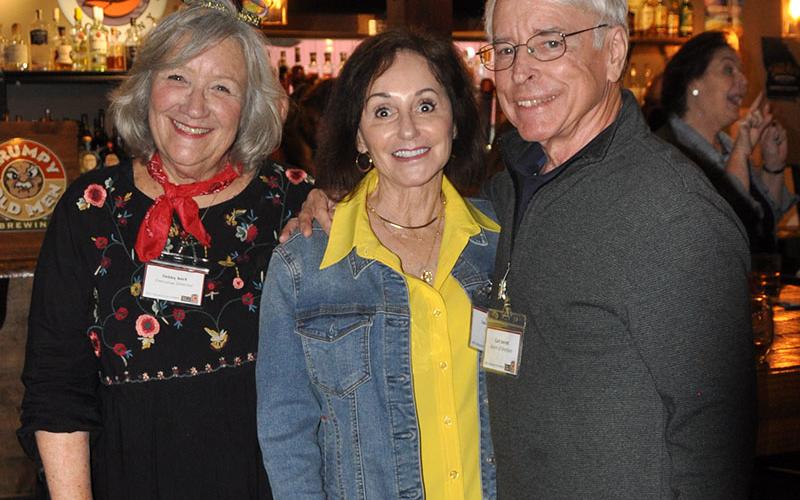 Snack in a Backpack Executive Director Debby Beck, left, is pictured with Leslie and Curt Jarrett at this year’s Champions for Children event at Fightingtown Tavern.