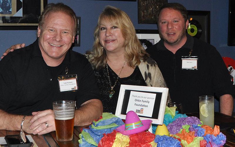 Pictured at Snack in a Backpack’s Champions for Children event are, from left, Todd Plunkett, Greer Plunkett, and Sam Farra. The Orkin Family Foundation is one of Snack’s many sponsors. Debby Beck credits all of Snack’s sponsors with making sure the organization meets its goal of supplying weekend meals to Fannin County school students. Beck, Snack in a Backpack’s executive director, told the crowd that nearly 70,000 meals have been distributed for the 2022/2023 school year.