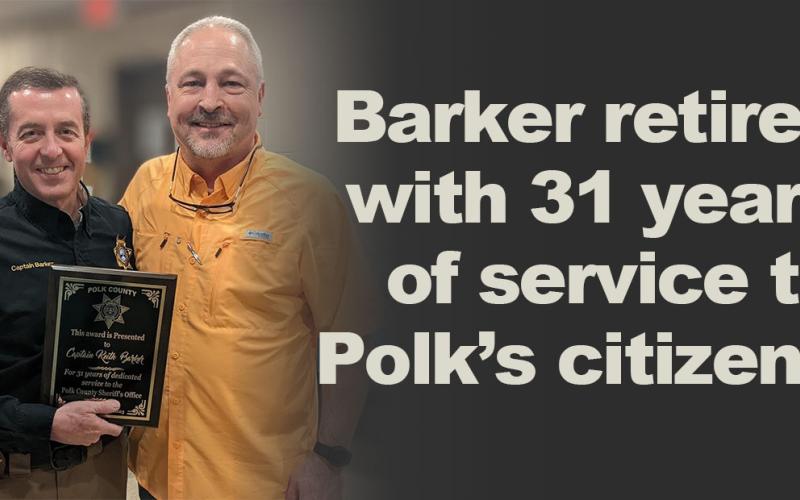Polk County Sheriff Steve Ross, right, presented Keith Barker a plaque recognizing his 31 years of service to the sheriff’s office and the citizens of Polk County.