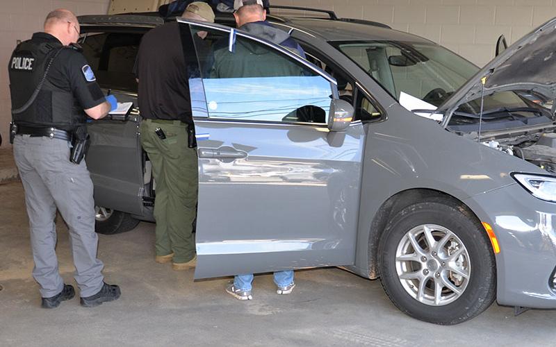 Law enforcement officials are show as they search the van a trio of burglary suspects were driving. Two of the three were caught by Fannin County deputy sheriffs Sergeant Jessie Godsey and Kaylee Robertson.
