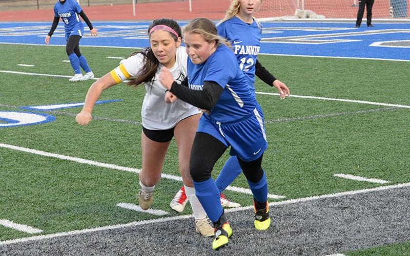 Lady Rebel Emma Richardson battles for the ball in recent Fannin soccer action.