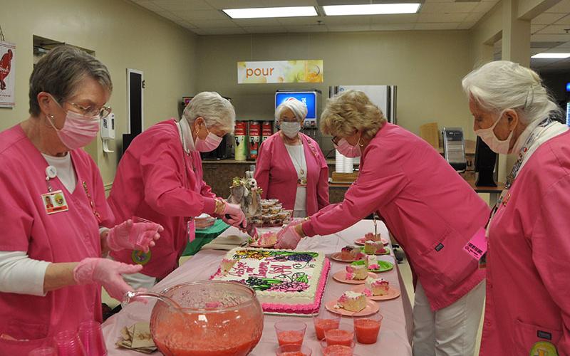 These Pink Ladies, Barbara Cheatham, Carole Thomas, Laura Haight, Becky Guthrie, and Joan Huddleston, make sure everything is ready for hospital employees during the March 20 reception. Shirley Copeland said that because of COVID-19 this was the first time in several years the Pink Ladies were able to hold the annual reception that recognized the hard work and caring of the staff at Fannin Regional Hospital.
