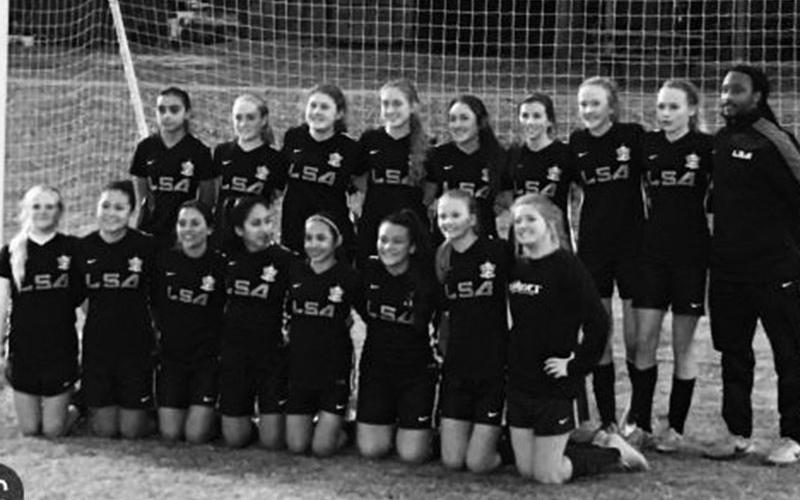 Avram Allen, back left, is pictured with players at Lanier Soccer Association (LSA) in Gainesville, Georgia.