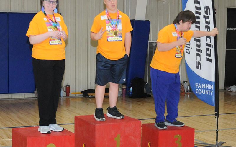 Mountain Area Christian Academy participants Sarah Campbell, Austin Pankey and Brady Spry stand proudly as winners in the Fannin County Special Olympics Track and Field event last Friday at the Fannin County Recreation Department.