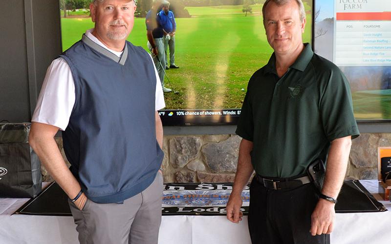 Gilmer County Sheriff Stacy Nicholson, left, was among the 116 golfers battling in the Corporal Richard Gazaway Memorial Golf Tournament. He was welcomed to the event by Fannin County Sheriff Dane Kirby.