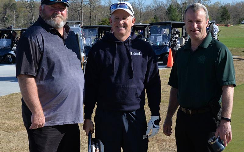 Johnny Chastain, center, District 7’s representative to the Georgia State House of Representatives, was welcomed to the Corporal Richard Gazaway Memorial Golf tournament by Fannin County Sheriff Dane Kirby, right, and Leslie Cheek.
