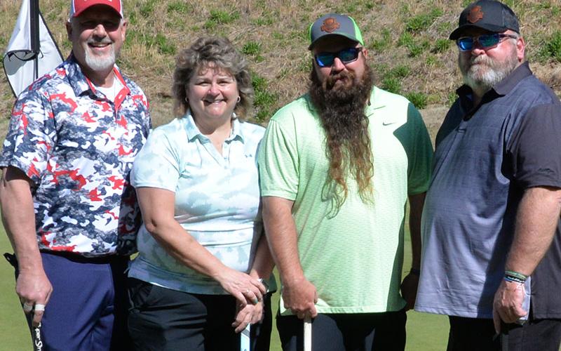 A total of 29 teams of four golfers each battled the Old Toccoa Farm, but few were more determined than, from left, Matt Zurzolo, Beth Cheek, Dustin Cheek and Leslie Cheek.