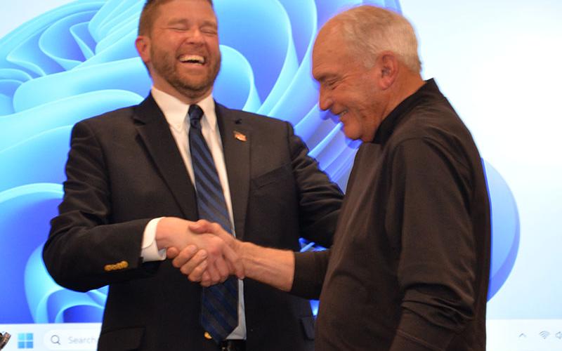 Dr. Michael Gwatney shares a laugh with former Fannin County School Superintendent Morgan Arp.