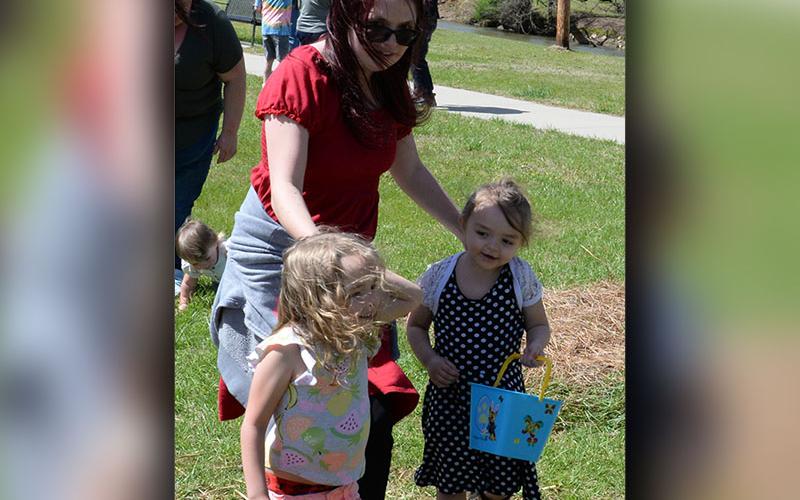 These young ladies got a little help as they hunted Easter Eggs in the Toccoa River Park.