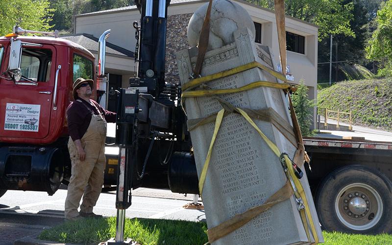 Lee Dillard took extra care moving the monument from its base to a safe resting position on his truck.