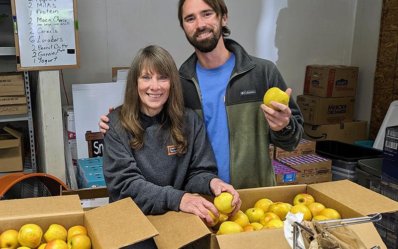Barbara Davenport and Zac Meaders are two of the volunteer leaders who help Snack in a Backpack prepare food for children every week.