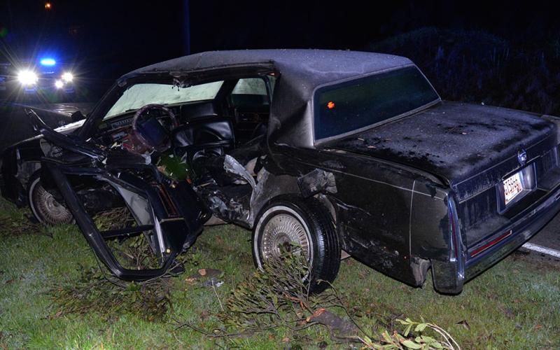 This Cadillac Deville was parked in a lot off Toccoa Avenue in McCaysvile when it was struck by the Kia Sorento rammed in an early morning domestic chase that began in the Airport Road area of Polk County.