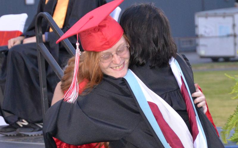 Alyssa Payne gets a big hug from Zulma Youngs.