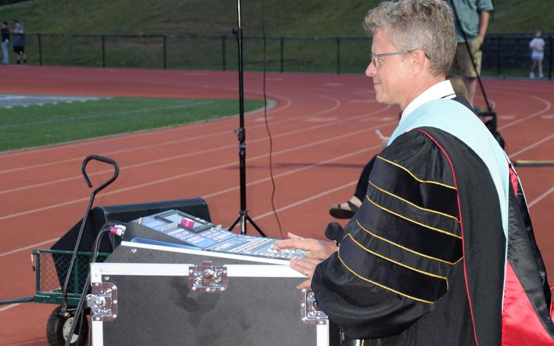 Fannin County High School Band Director Scott Barnstead did double duty at graduation, running the sound board for the band led by Carson Collis.