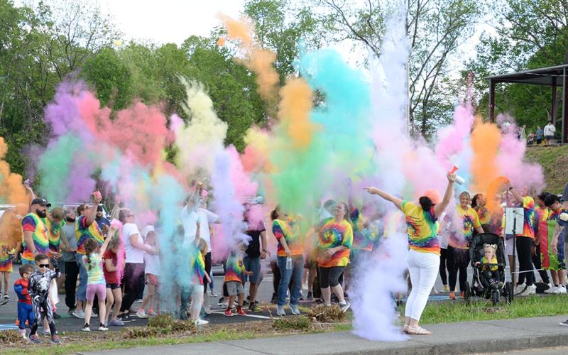 A burst of color covered runners before the start of Sydnie’s Sunset Fun Run, a color run in honor of Sydnie Jones. The run followed a dedication ceremony and preceeded skating, music and food at the dedication of Syd’s Place Saturday.