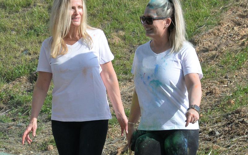 Blue Ridge city councilwomen Angie Arp, left, and Christy Kay, were among the many participants who took part in Sydnie’s Sunset Run and other dedication ceremonies for Highland Outdoor Ministry’s new facility on East First Street.