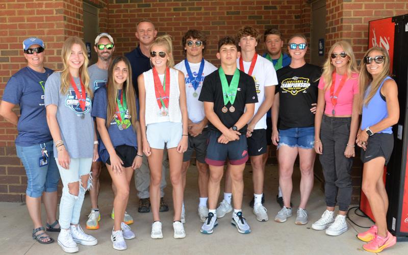 Many of the Fannin track and field athletes and coaches went to the GHSA State Championship. Pictured, from left, Assistant Coach Hannah Godfrey, Ava Acker, Assistant Coach Lucas Roof, Karli Sams, Assistant Coach Chad Galloway, Lindsey Holloway, Corbin Davenport, Zechariah Prater, Tyler Stevenson, Matthew Crowder, Assistant Coach Alden Falls, Carlee Holloway, Head Coach Miranda Roof.