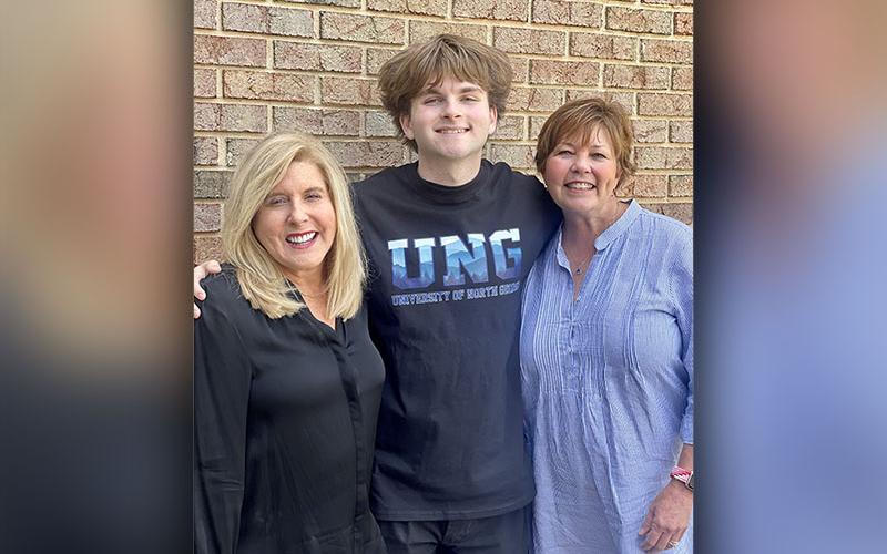The author, Preston Patterson, is shown with his subject, Sally Masters, right, and Swan McKnight, another board member of Fannin Foster Families.