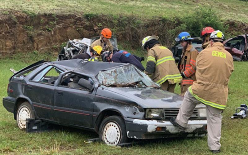 First responders work during an Auto Extrication Advanced Patient Handling Class at the Blue Ridge Kiwanis Club Fairgrounds.