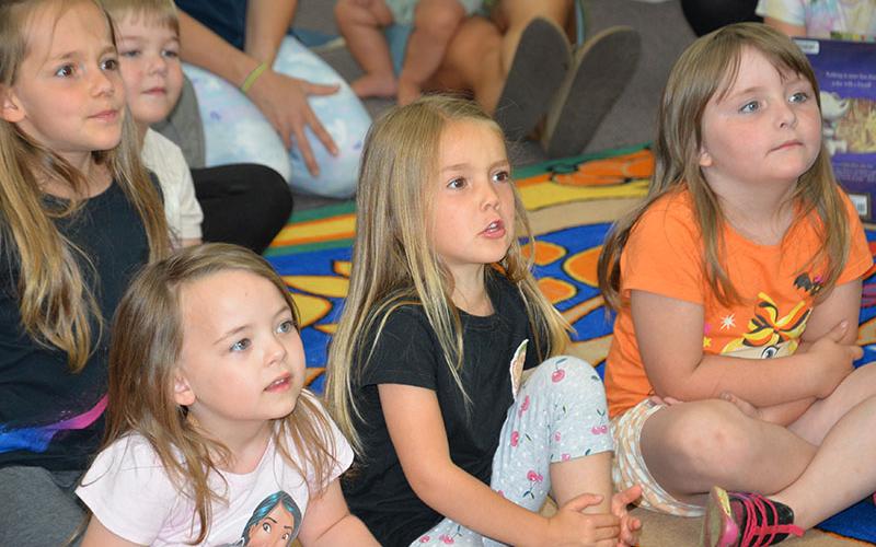 Storytime at the Fannin County Public Library last Wednesday held the attention of this group of youngsters. Storytime is a weekly, Wednesday event at 11 a.m. and again at 4 p.m.