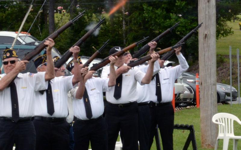 Members of the North Georgia Honor Guard performed a rifle salute during the Memorial Day ceremony at Veterans Memorial Park.