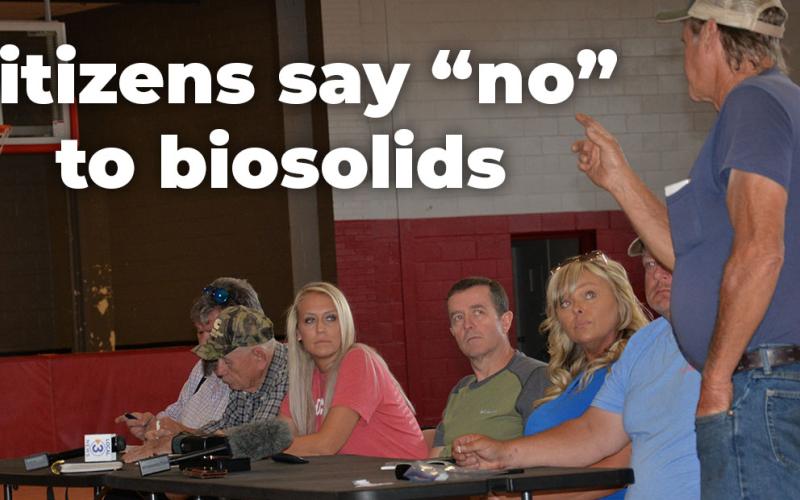 Rick Boring, standing, makes a point to Polk County commissioners, from left, Samantha Trantham, Keith Barker, Kelley Morgan and Greg Brooks during the town hall meeting Saturday at Copper Basin Elementary School. Boring reminded the crowd how a previous group had attempted to use the former industrial and mining sites in Copperhill as a landfill.