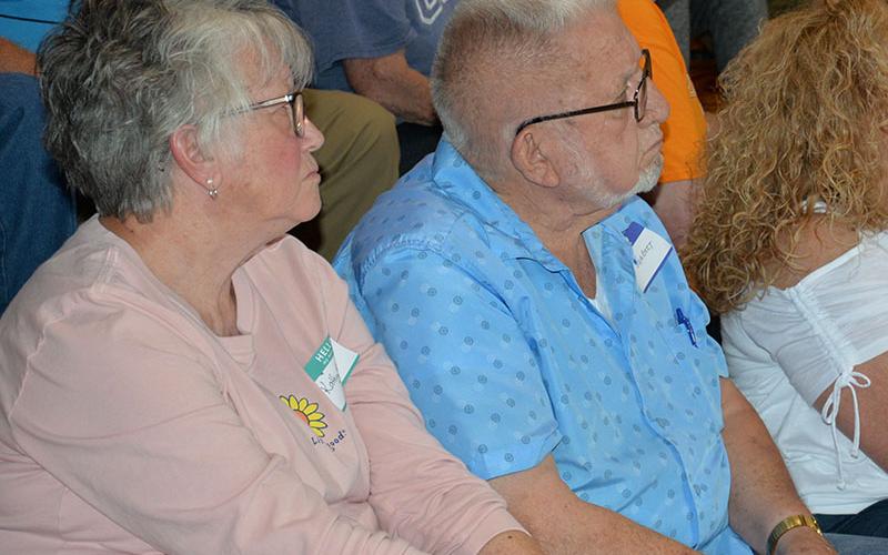 Copperhill Mayor Kathy Stewart, left, and McCaysville Mayor Thomas Seabolt listen to complaints over biosolids at a town hall meeting Saturday. Neither addressed the gathering at Copper Basin Elementary School.