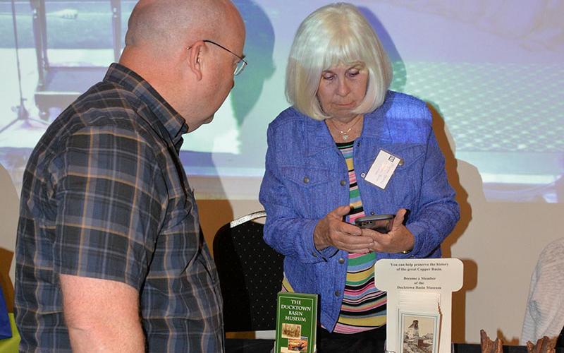 The Ducktown Basin Museum was one of the many organizations represented last Thursday night at Tooney’s as visitors learned the importance of recreation to the Ocoee/Toccoa area. Here, Myrna Brooks discusses the museum with a visitor.