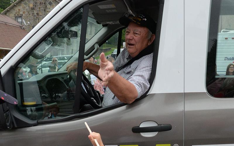 Paul Hunter passed out flags from the Disabled American Veterans van.
