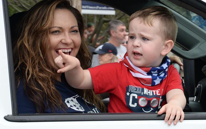 This youngster was fascinated by the large crowd gathered for the Old Timers’ Parade.