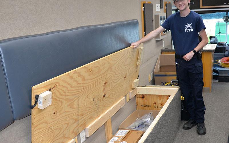 Trent Lowery shows off some of the additional storage space in the Fannin County Emergency Management Agency’s new Mobile Command Center.