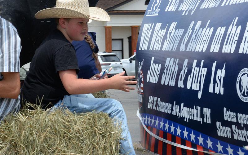 A hay bale made this young cowboy’s ride comfortable during the parade through McCaysville and Copperhill.