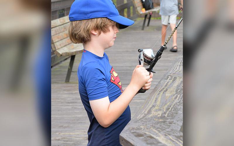 Simon tried his luck during the Kids Fishing Rodeo sponsored by the City of McCaysville. The event was followed by a community hotdog cookout, also sponsored by the city. These were two of the activities leading up to the annual fireworks show.