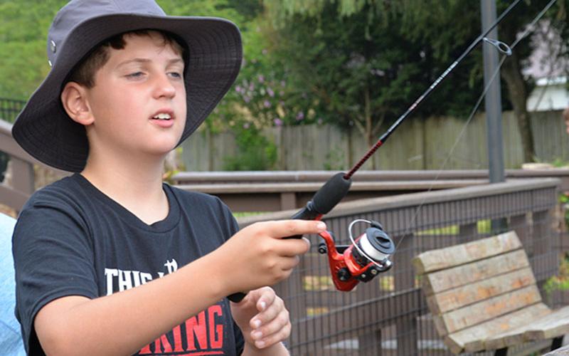 Zeke was determined to catch a fish at the Kids Fishing Rodeo sponsored by the City of McCaysville.