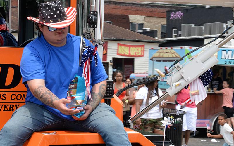 A parade to celebrate the Fourth of July has to be complete with plenty of red,white and blue as this participant shows.
