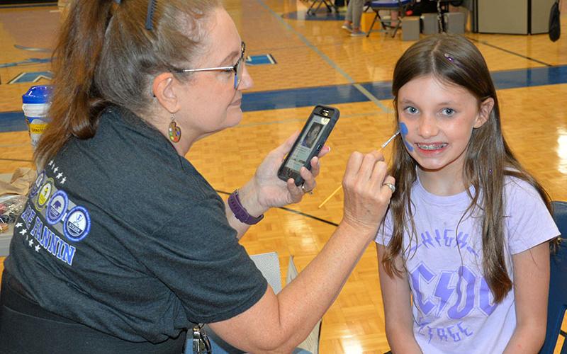 Kari Mae is all smiles as she gets her face painted at the Back to School Bash this past Saturday. The event not only provided needed school supplies, it also offered food and fun for participants.