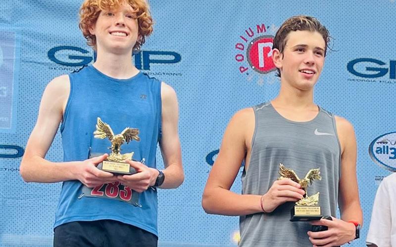 Koen Verner, left, was the overall winner in the Freedom 5K with a time of 17:24. He is shown after the race with runner-up Charles Clark.