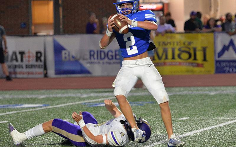 Fannin County’s Lawson Sullivan (2) sets up to throw as he escapes the clutches of a Union County defender Thursday night in Blue Ridge.