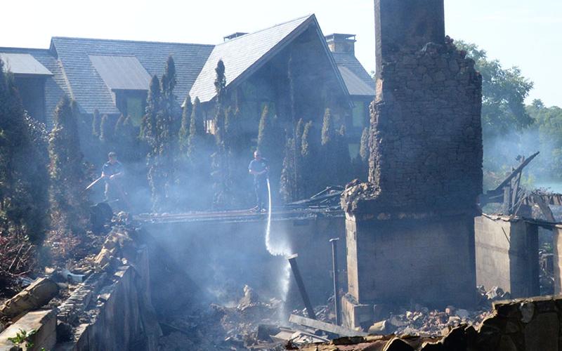The morning after a Blue Ridge Lake home was destroyed by fire, it was easy to see how close a neighbor’s house is located, which was not damaged by the blaze.