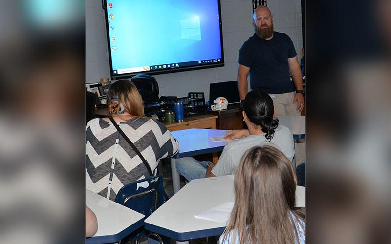 Travis Stone told incoming freshmen that their Chromebooks must be charged when they come into his class at Fannin County High School.
