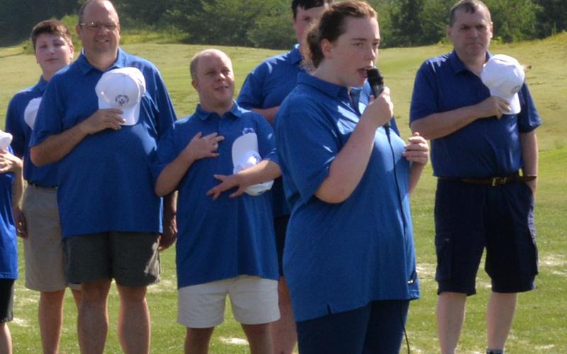 Ansley Price sang the National Anthem during the opening ceremony for the Special Olympics Golf Skills Event. Shown behind her are, from left, Alex Hughes, Rick Kruse, Jay Jenkins, Mikey Elliot, and Kevin Turner.