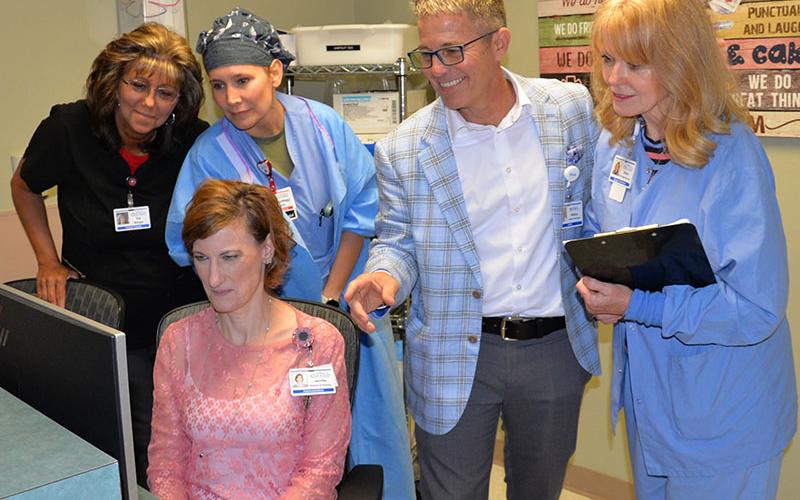 Blue Ridge Medical Center’s Jennifer Richbourg, director of nursing, seated, and standing. from left, Eva White, supervisor, Materials Management; Courtney Crain, CRNA; William Henry, chief executive officer, and Evelyn Hammond, director, Surgical Services review a patient’s progress following surgery at the hospital last week. “While the patient is here, we do what they need,” Richbourg said.