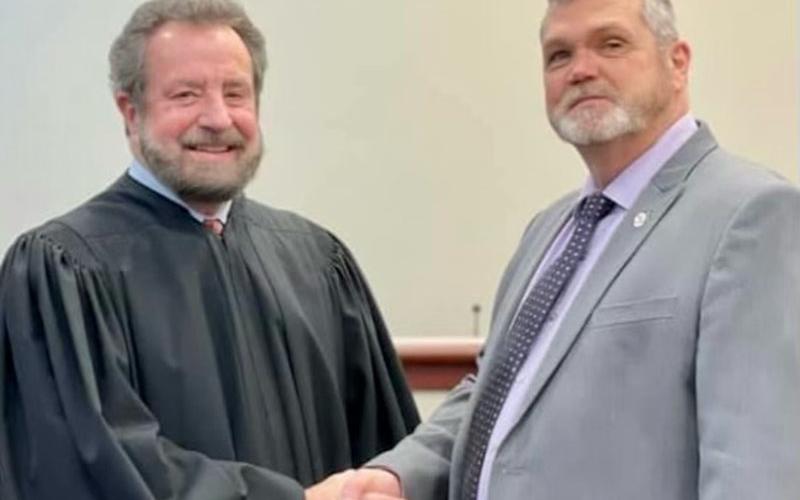 Judge John Worcester, left, is shown after swearing in Chief Magistrate Judge Brian Jones.