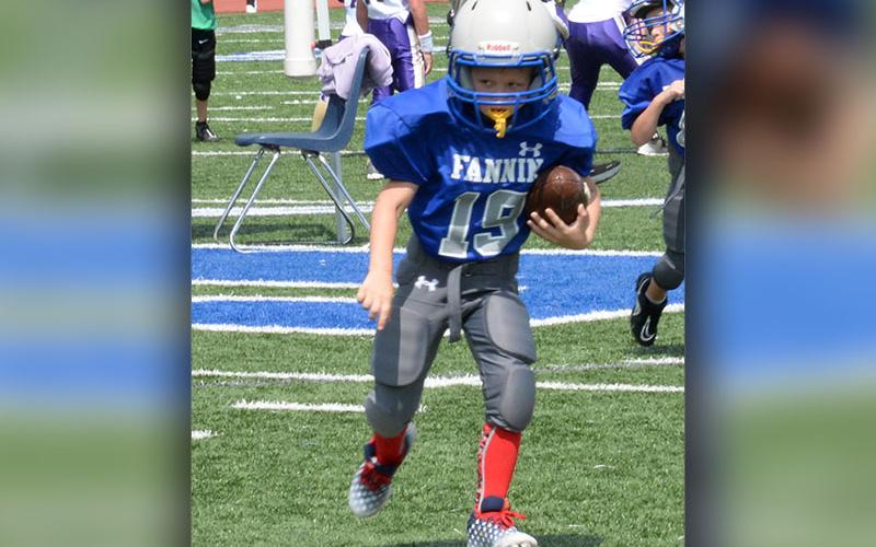Rebel Parker Mathews takes the ball down field in one of the FCRD’s football game Saturday, August 12.